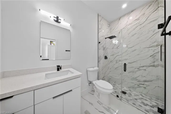 Unfurnished room with recessed lighting and attic access