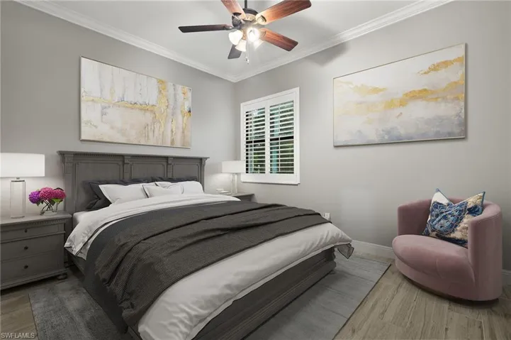 Bedroom featuring ceiling fan, ornamental molding, and hardwood / wood-style floors
