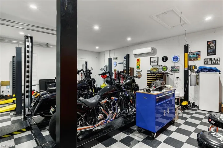 Exercise room featuring a wall mounted AC