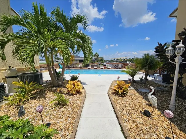 View of swimming pool with central air condition unit