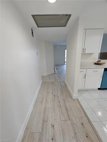 Corridor featuring light hardwood / wood-style flooring