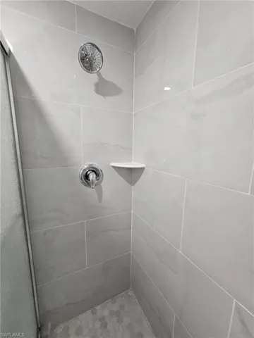 Bathroom featuring tiled shower