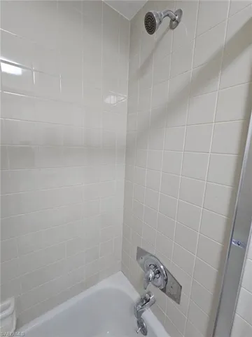 Guest Bathroom featuring tiled shower / bath combo