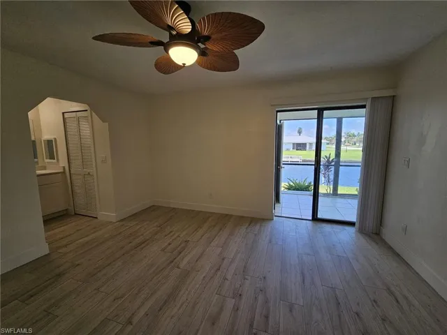 Master bedroom featuring ceiling fan / wood-style floors