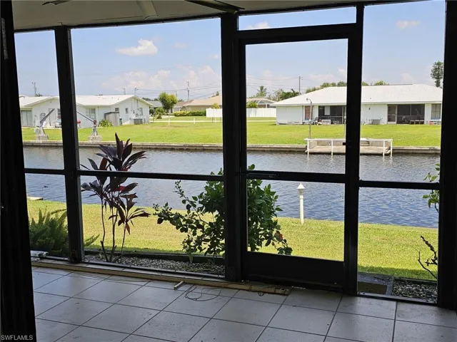 Sunroom with a water view