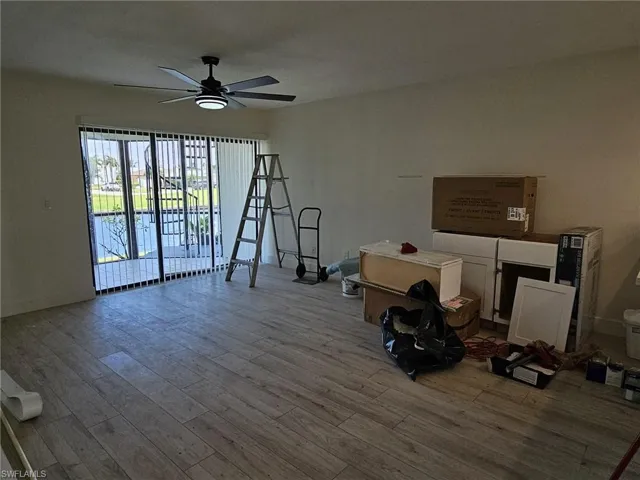 Miscellaneous room featuring hardwood / wood-style floors and ceiling fan