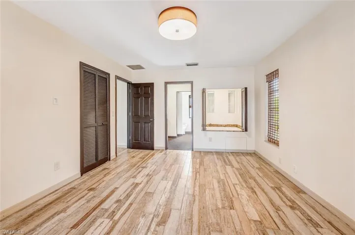 Unfurnished bedroom with light hardwood / wood-style floors