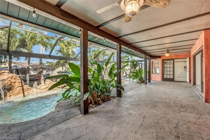 View of pool with ceiling fan
