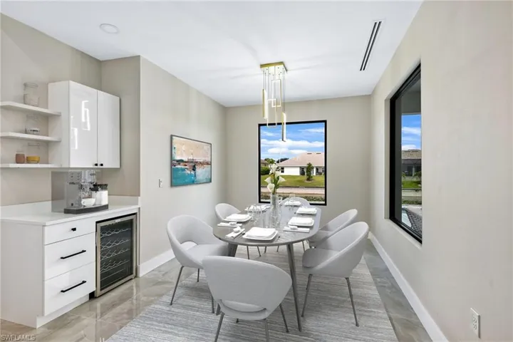 Dining space with beverage cooler and light tile floors
