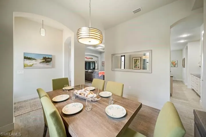 Dining space with light hardwood / wood-style floors