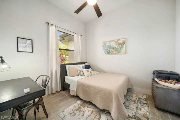 Bedroom with vaulted ceiling and ceiling fan
