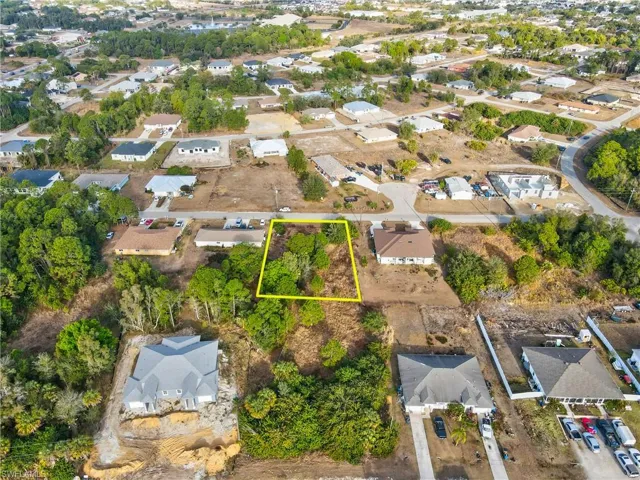 Aerial view of residential area with property parcel outlined