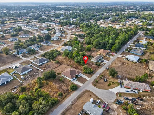 Aerial overview of property's location featuring nearby suburban area