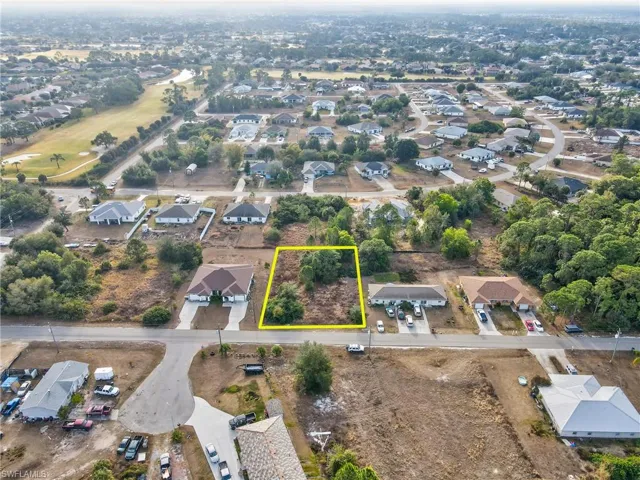 View of property location featuring property boundaries highlighted and nearby suburban area
