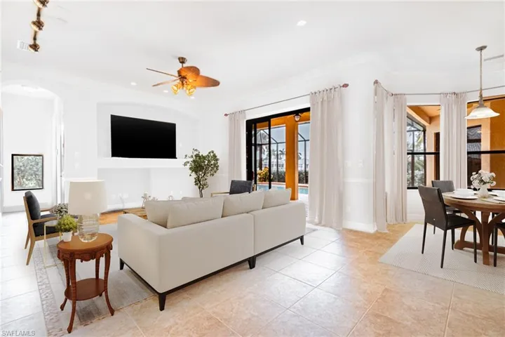 Digitally staged living room - entire home was just painted white inside (3/17/24)