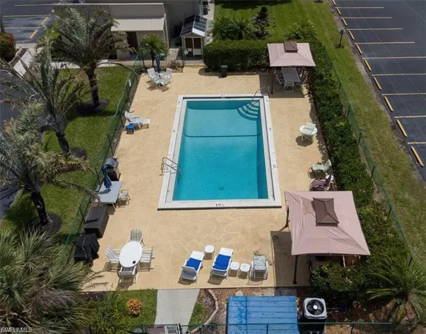 Community pool with a patio area