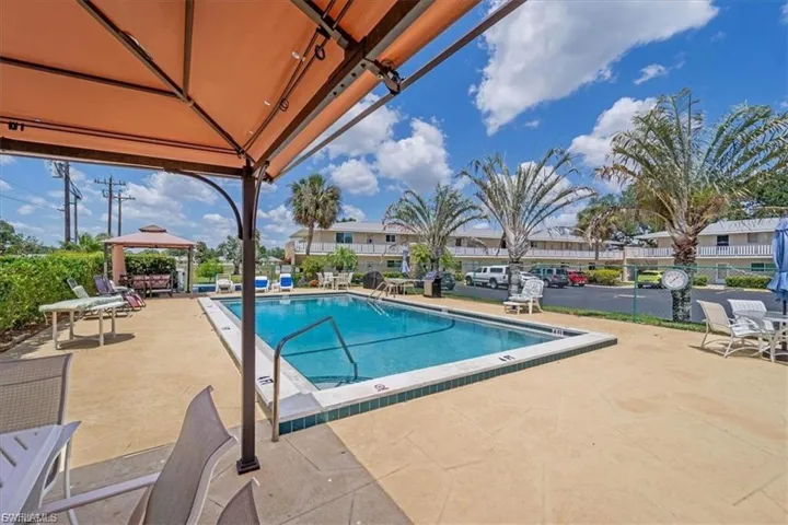 Community pool featuring a patio area and a gazebo