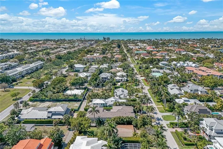 Aerial view featuring a residential view and a water view