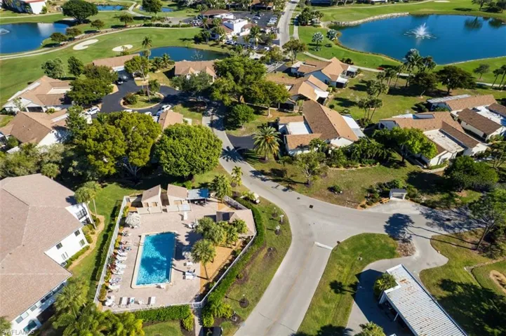 View of property location featuring a large body of water and nearby suburban area