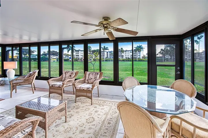 Sunroom / solarium with plenty of natural light and tile patterned floors