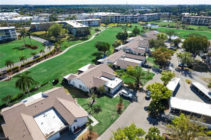 Aerial view of a local golf course and a large body of water