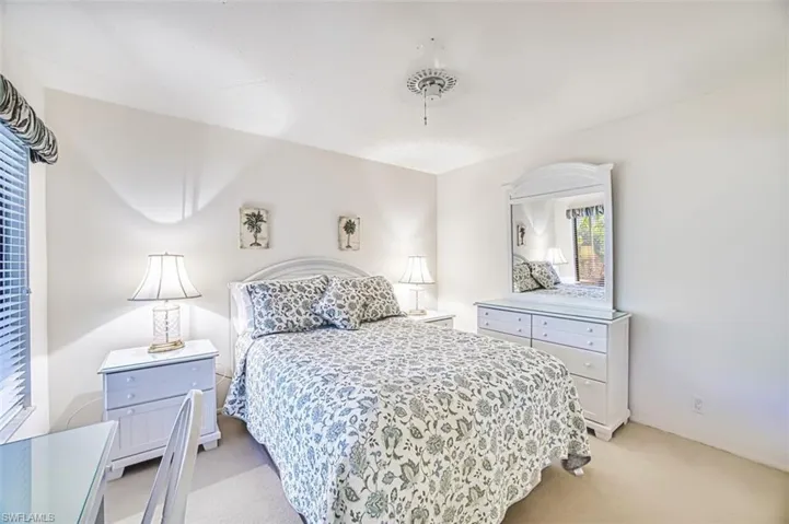 Bedroom with light carpet