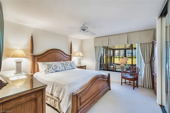 Carpeted bedroom with ceiling fan