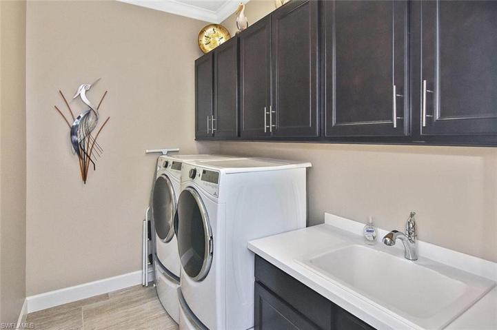 Laundry Room with utility sink and plenty of storage.