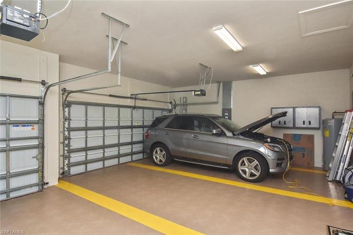 3-car Garage with custom interlocking washable flooring