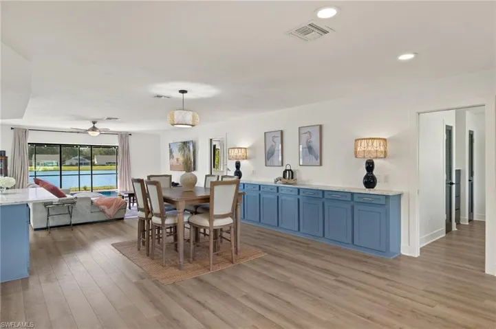 Dining room featuring ceiling fan and light wood-type flooring
