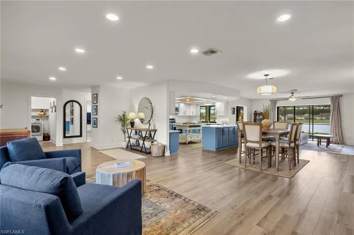 Living room featuring light hardwood / wood-style floors and ceiling fan