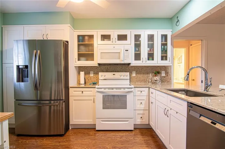 The beautiful granite counter top extends into a lovely backsplash to provide the finishing touch!