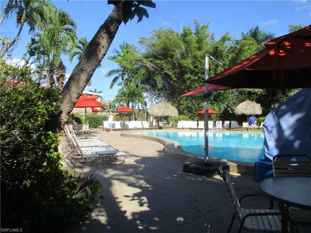 Community pool featuring a patio area, and outdoor dining space