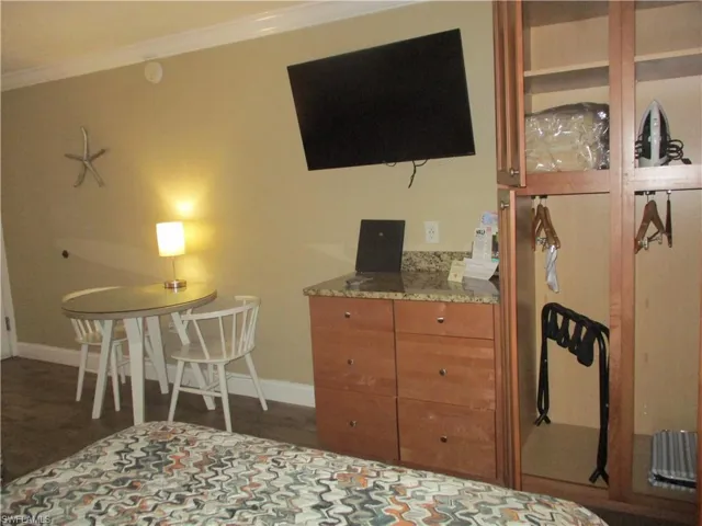 Room with beautiful cabinetry, table with seating for 2