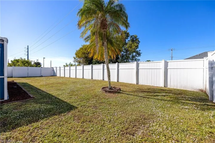 View of fenced backyard