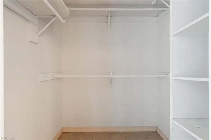 Spacious closet with tile patterned flooring