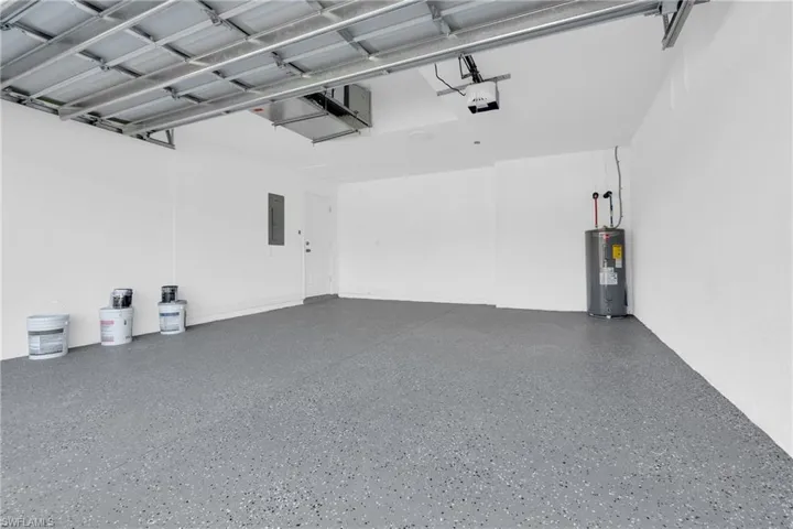 Garage with electric water heater and electric panel
