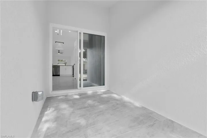 Empty room featuring a textured wall