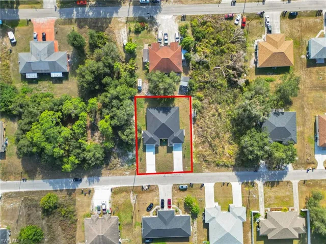 Aerial perspective of suburban area with property parcel outlined