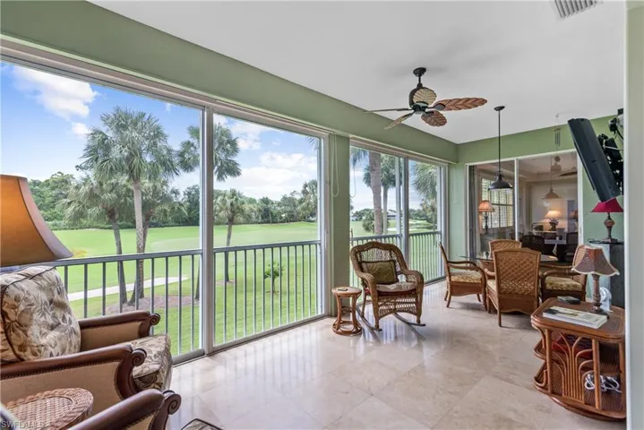 Sunroom with plenty of natural light and ceiling fan