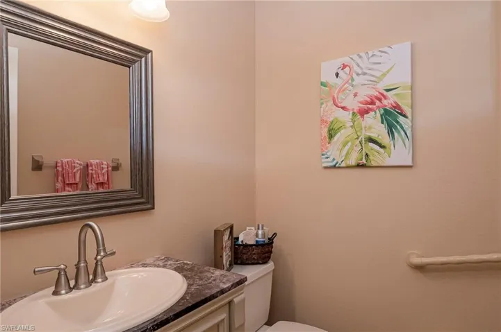Half Bath that leads to garage and accommodates third bedroom.