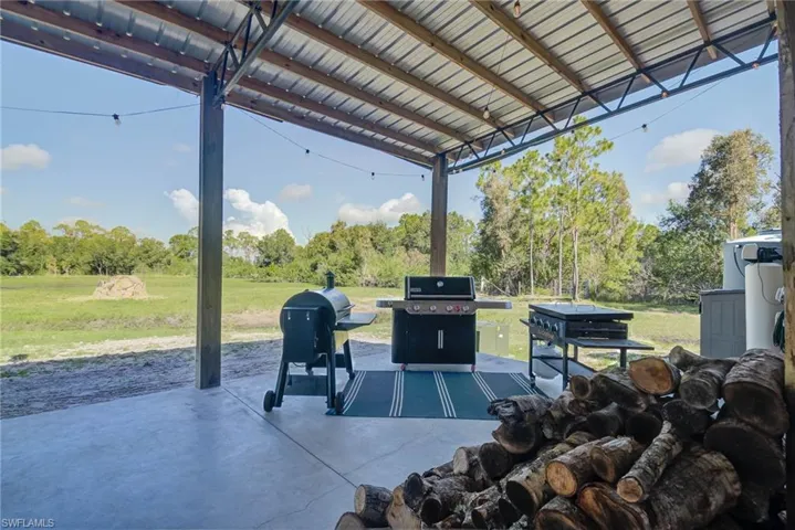 View of patio with view of wooded area