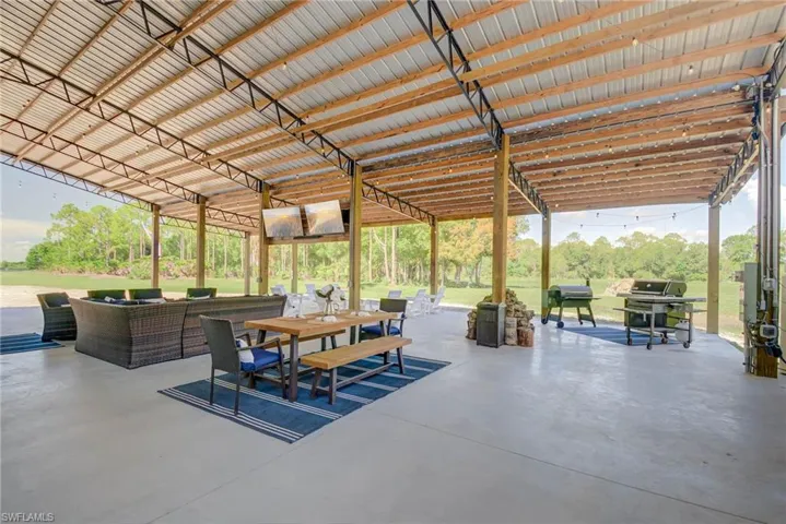 View of patio / terrace featuring outdoor lounge area, outdoor dining area, and a grill