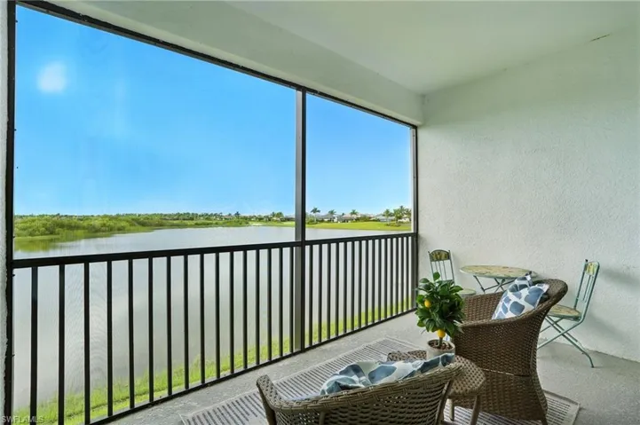 Sunroom / solarium with a water view