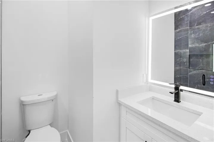 Bathroom with vanity and toilet