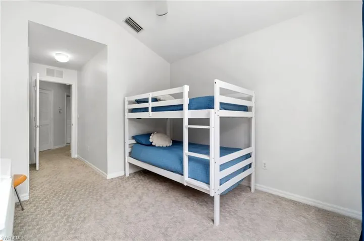 Guest bedroom 1 with lofted ceiling