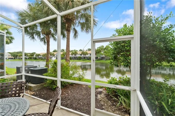 Screened in lanai with view of lake