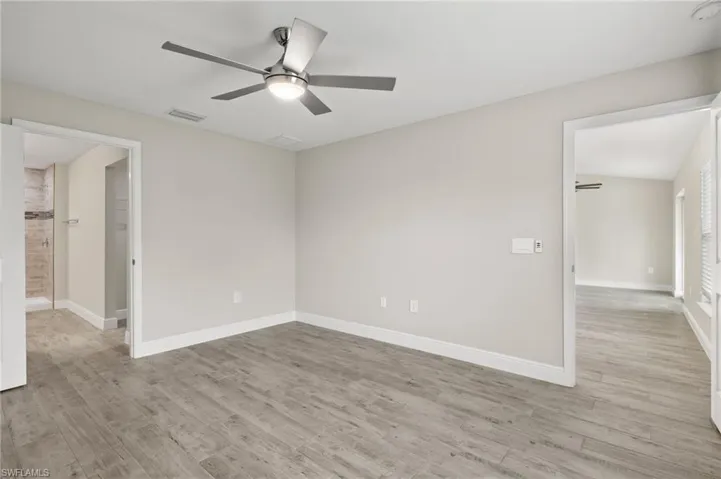 Unfurnished room featuring ceiling fan and light hardwood / wood-style floors