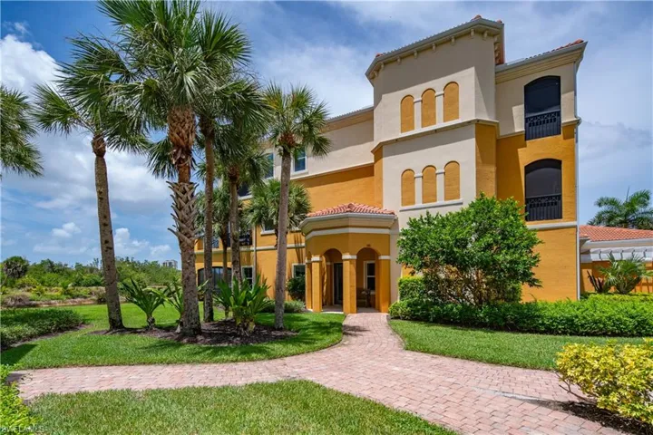 Mediterranean / spanish home with a front lawn