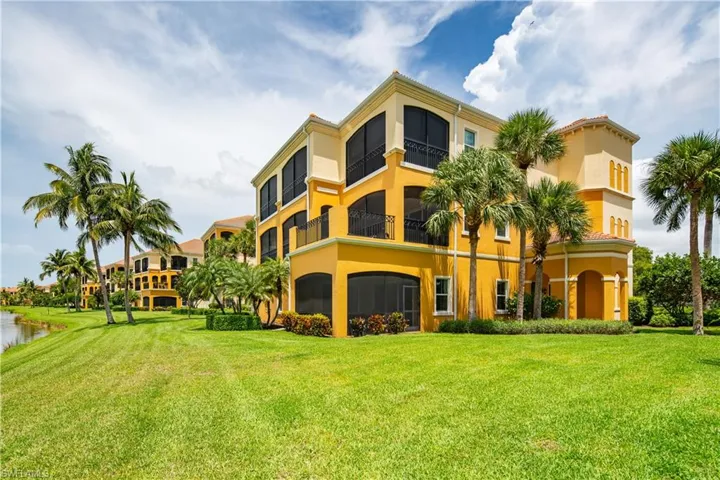 Back of property featuring a yard